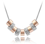 Dije 9 Aros Dorado con plata