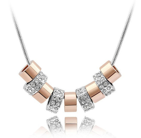 Dije 9 Aros Dorado con plata